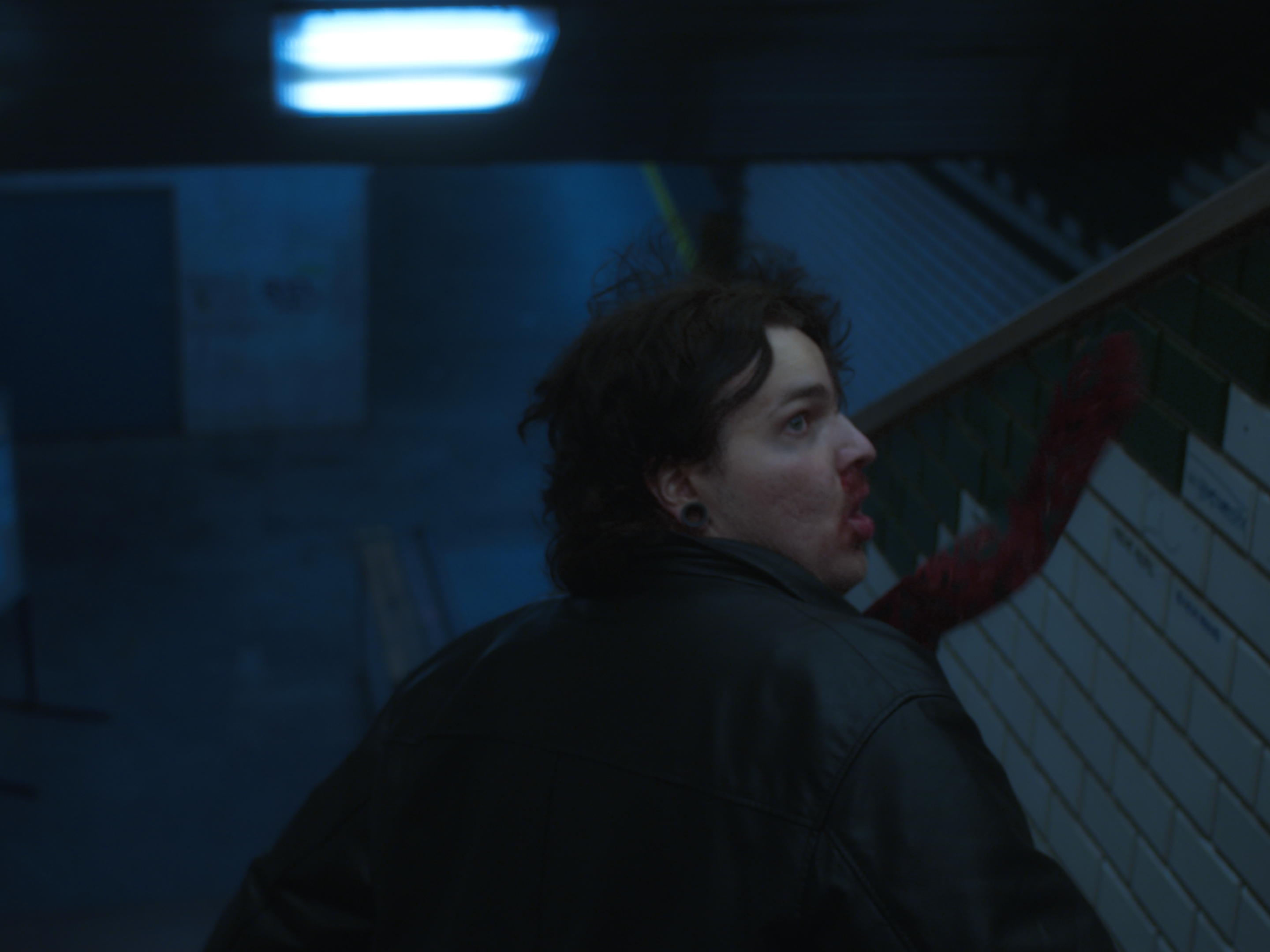 Music video production still showing urban location scouting